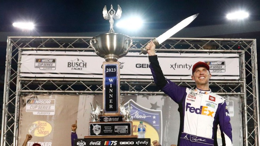 Denny Hamlin, driver of the No. 11 FedEx Freight Direct Toyota, celebrates in Victory Lane after winning the NASCAR Cup Series Bass Pro Shops Night Race at Bristol Motor Speedway. Image Credit- Jared C. Tilton Getty Images