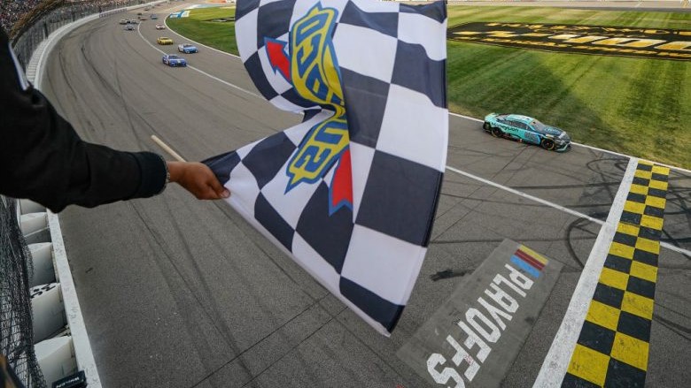 23XI Racing's Tyler Reddick, driver of the No. 45 MoneyLion Toyota, takes the checkered flag to win the NASCAR Cup Series Hollywood Casino 400 at Kansas Speedway - Image Credit Jay Biggerstaff-Getty Images