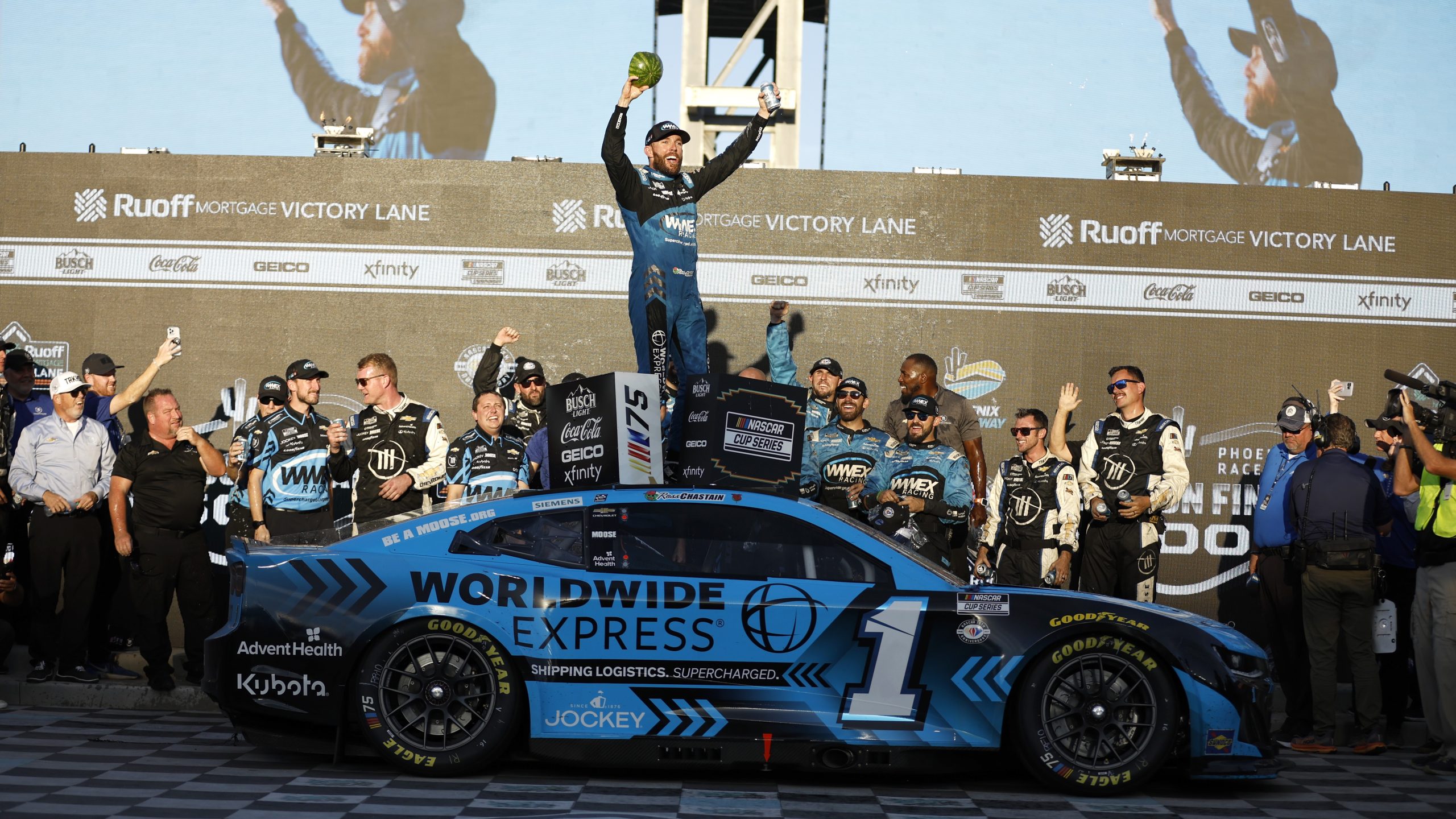 AVONDALE, ARIZONA - NOVEMBER 05: Ross Chastain, driver of the #1 Worldwide Express Chevrolet, celebrates in victory lane after winning the NASCAR Cup Series Championship race at Phoenix Raceway on November 05, 2023 in Avondale, Arizona. (Photo by James Gilbert/Getty Images)